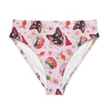 Stylish High-waisted Matsuri Bikini Bottom in pink with vibrant prints, perfect for summer beach adventures.