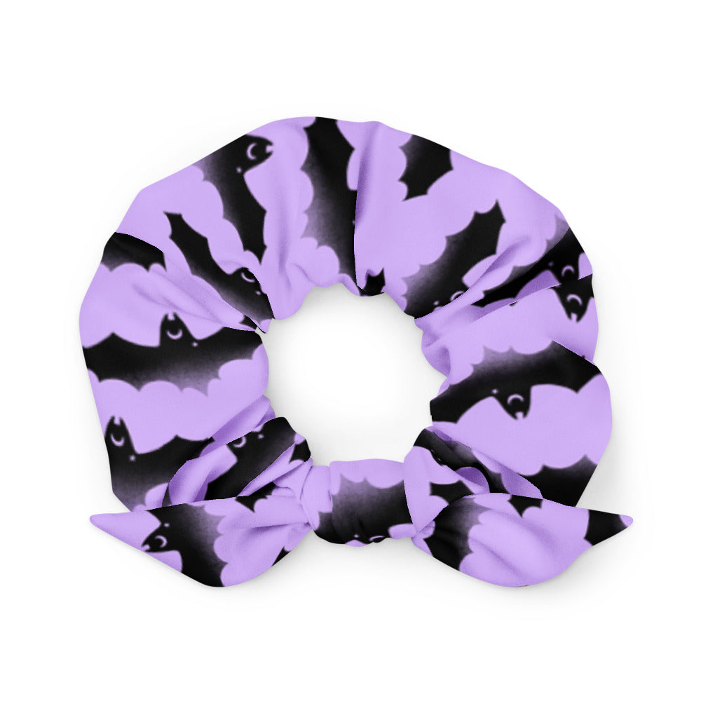 Morrigan Scrunchie features a trendy bat design, perfect for gym or night out, adding style to any outfit.