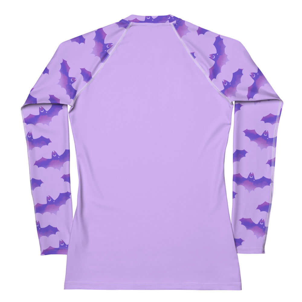 Morrigan Rash Guard in lavender features bat print sleeves, ideal for active sports and sun protection.