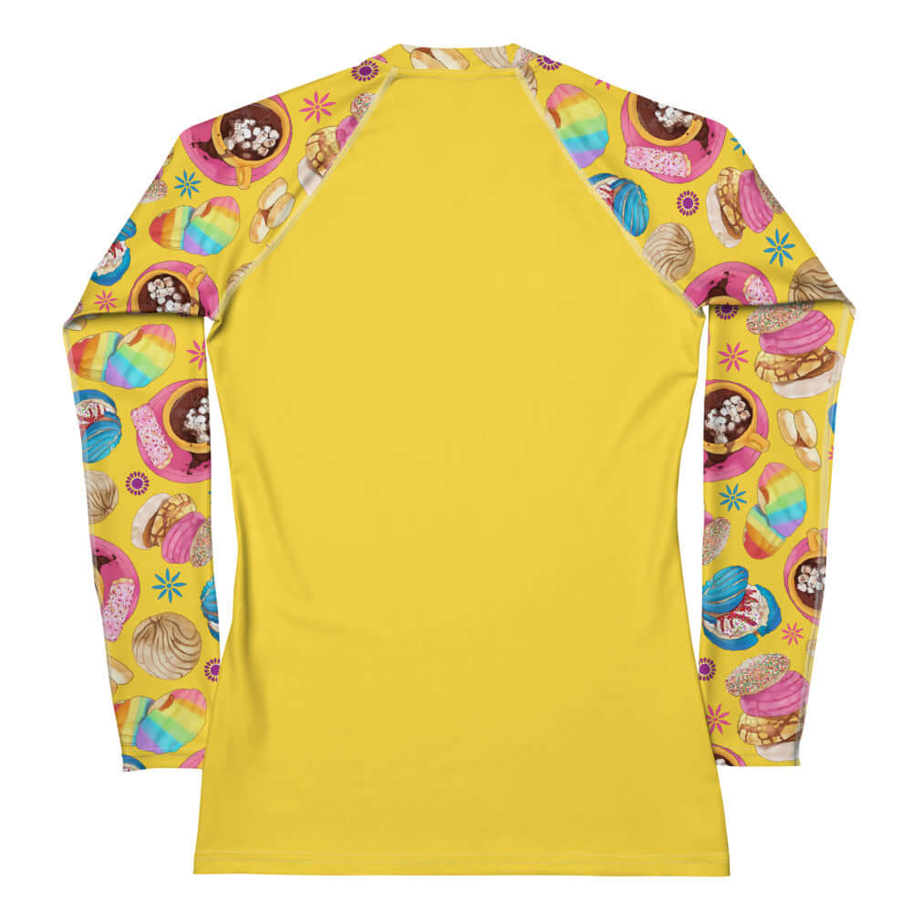 Pan Dulce Rash Guard featuring vibrant pastry designs, perfect for active days in the sun and water sports.
