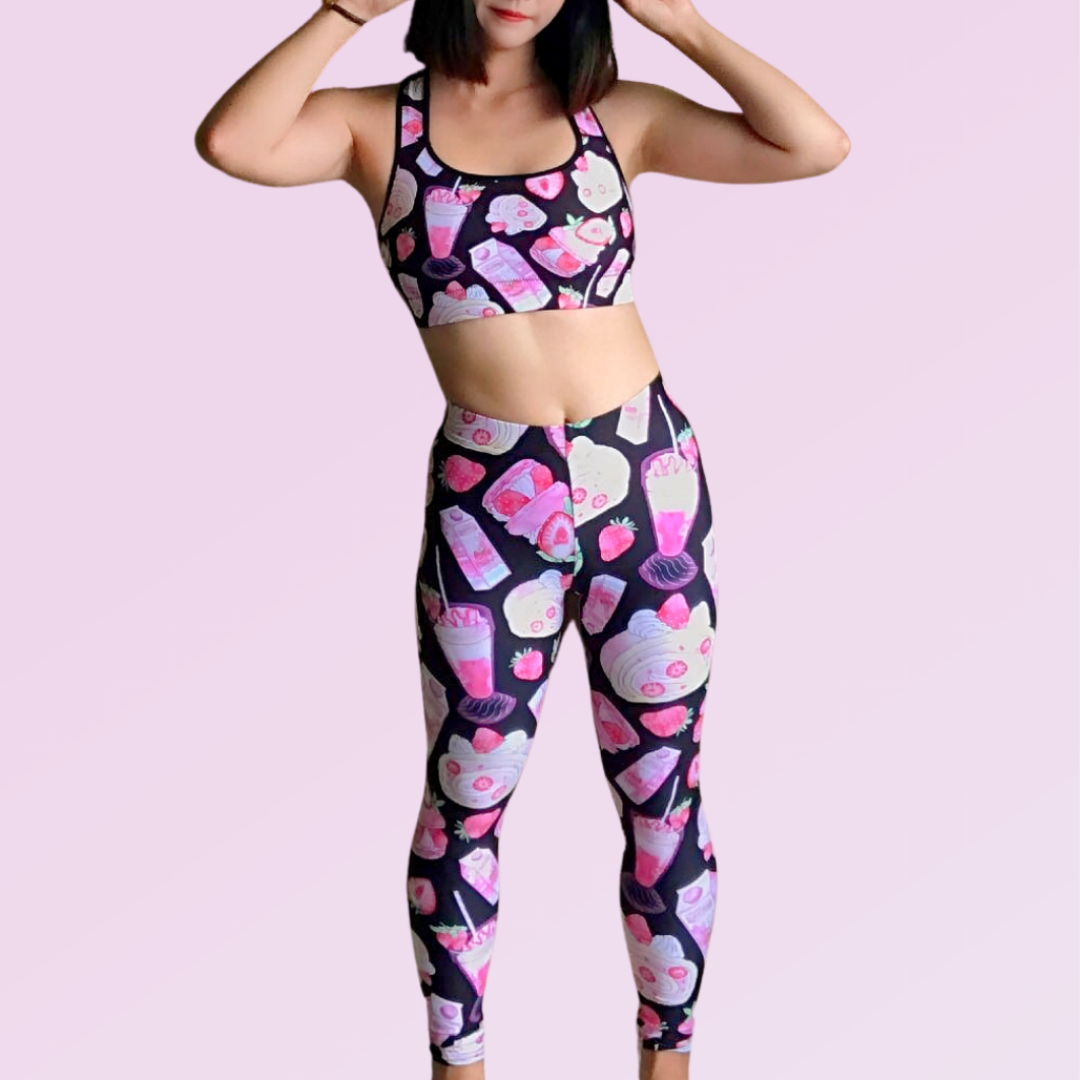 Woman in colorful leggings and crop top featuring fun dessert prints, perfect for playful and trendy outfits.