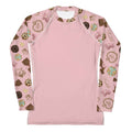 Royal Cookie Rash Guard features a playful design, perfect for active wear, ensuring comfort and sun protection.
