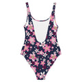 Sakura One-Piece Swimsuit featuring vibrant pink blossoms on a dark background, perfect for beach or pool days.