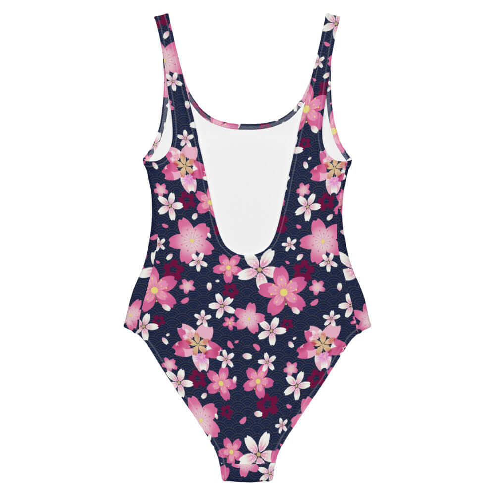 Sakura One-Piece Swimsuit featuring vibrant pink blossoms on a dark background, perfect for beach or pool days.