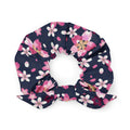 Enhance your style with the Sakura Scrunchie, featuring vibrant cherry blossoms on a navy background. Perfect for any outfit!