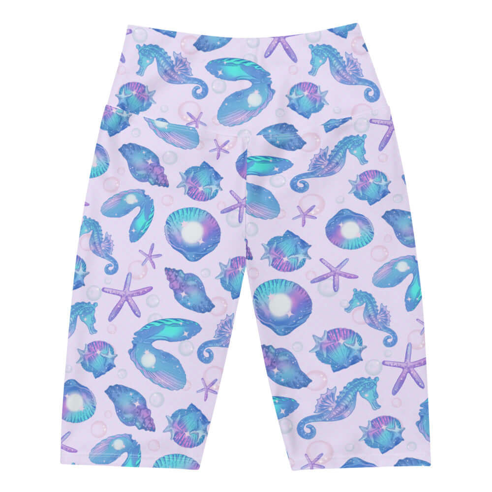 High-waisted Sea Princess Biker Shorts featuring a vibrant seashell pattern, perfect for summer workouts and beach days.