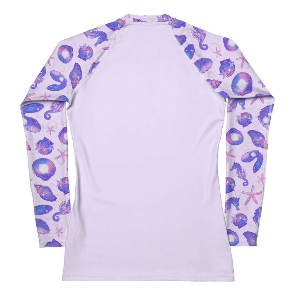Stylish Sea Princess Rash Guard features vibrant seashell designs, perfect for sun protection during active sports.