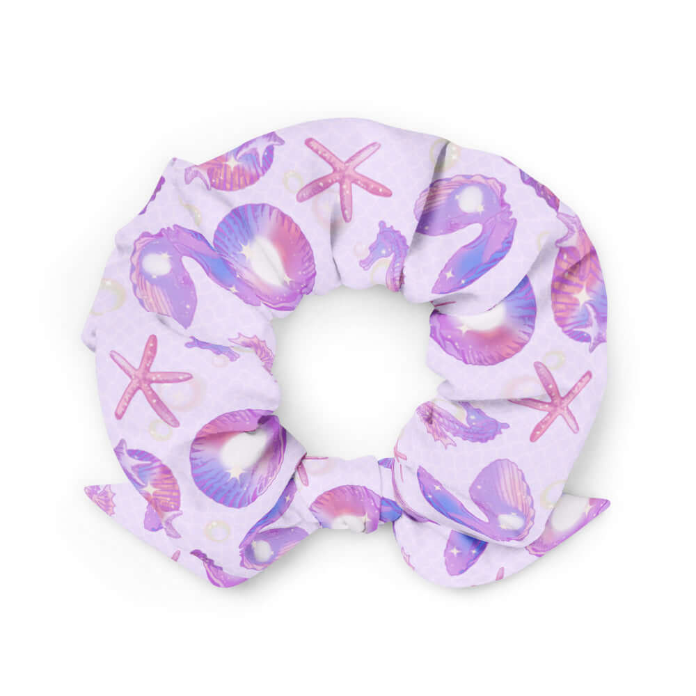 Elevate your style with the Sea Princess Scrunchie, featuring vibrant seashell patterns for a trendy summer look.