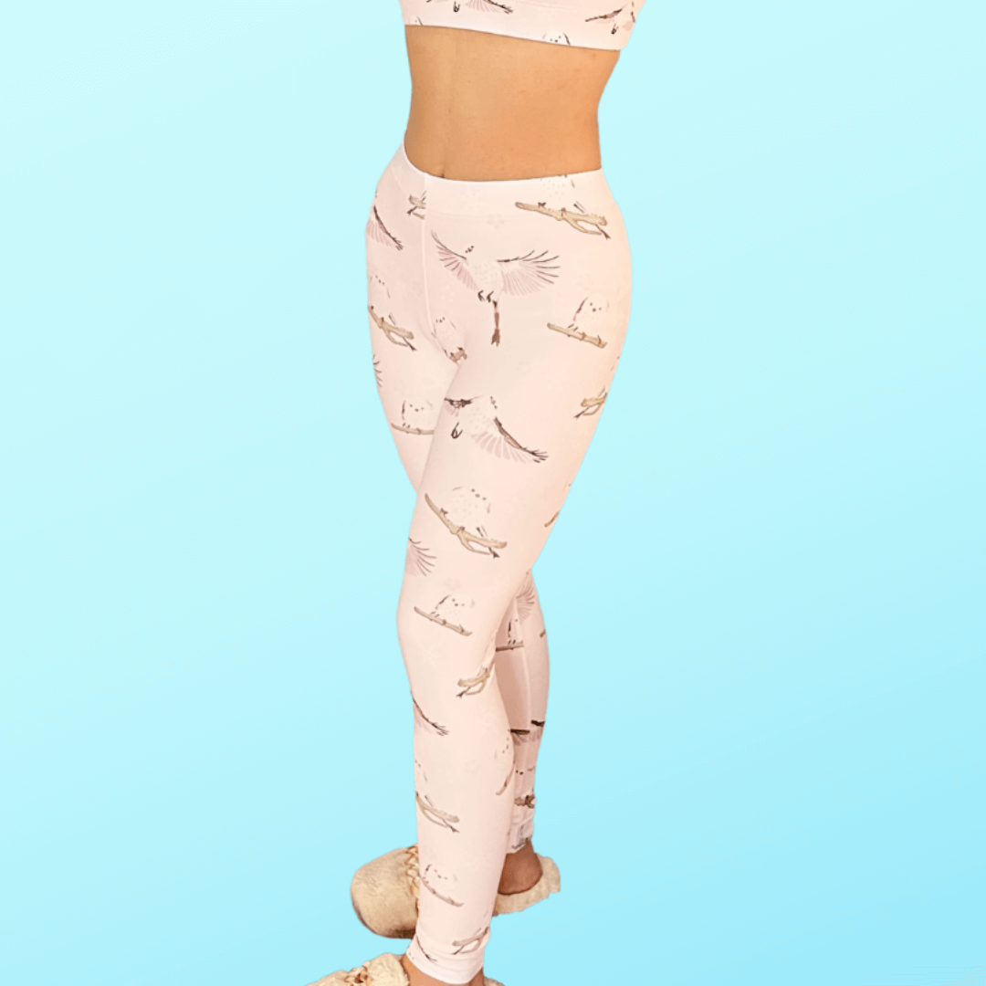 Stylish Snow Bird Leggings in soft pastels, featuring a charming bird print, perfect for winter comfort.