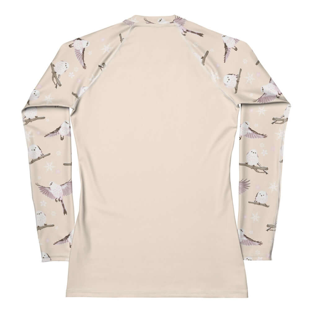 Snow Bird Rash Guard features a stylish design, perfect for active wear and sun protection during sports activities.