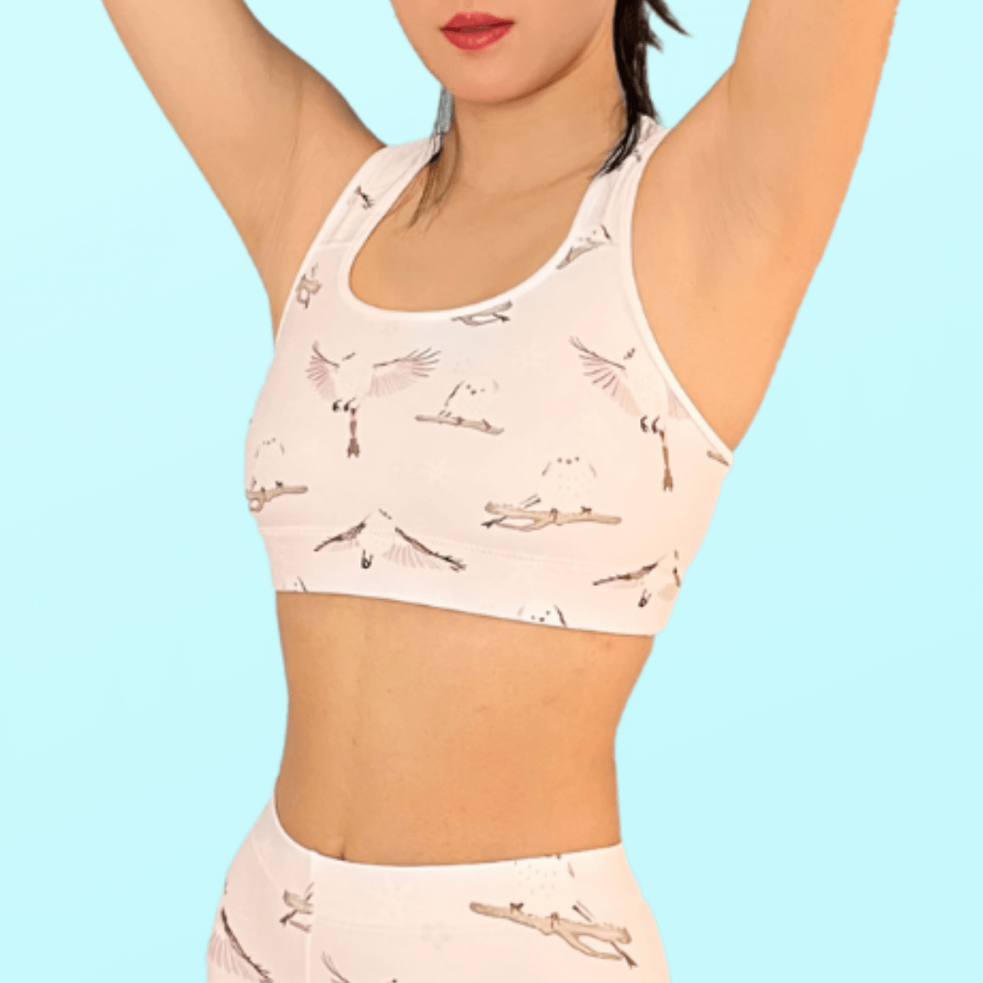 Stylish Snow Bird Sports bra features moisture-wicking fabric for comfort and cuteness during workouts.