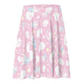 Adorable Snow Bunny Skater Skirt features playful bunnies on a pastel pink background, perfect for any outfit.