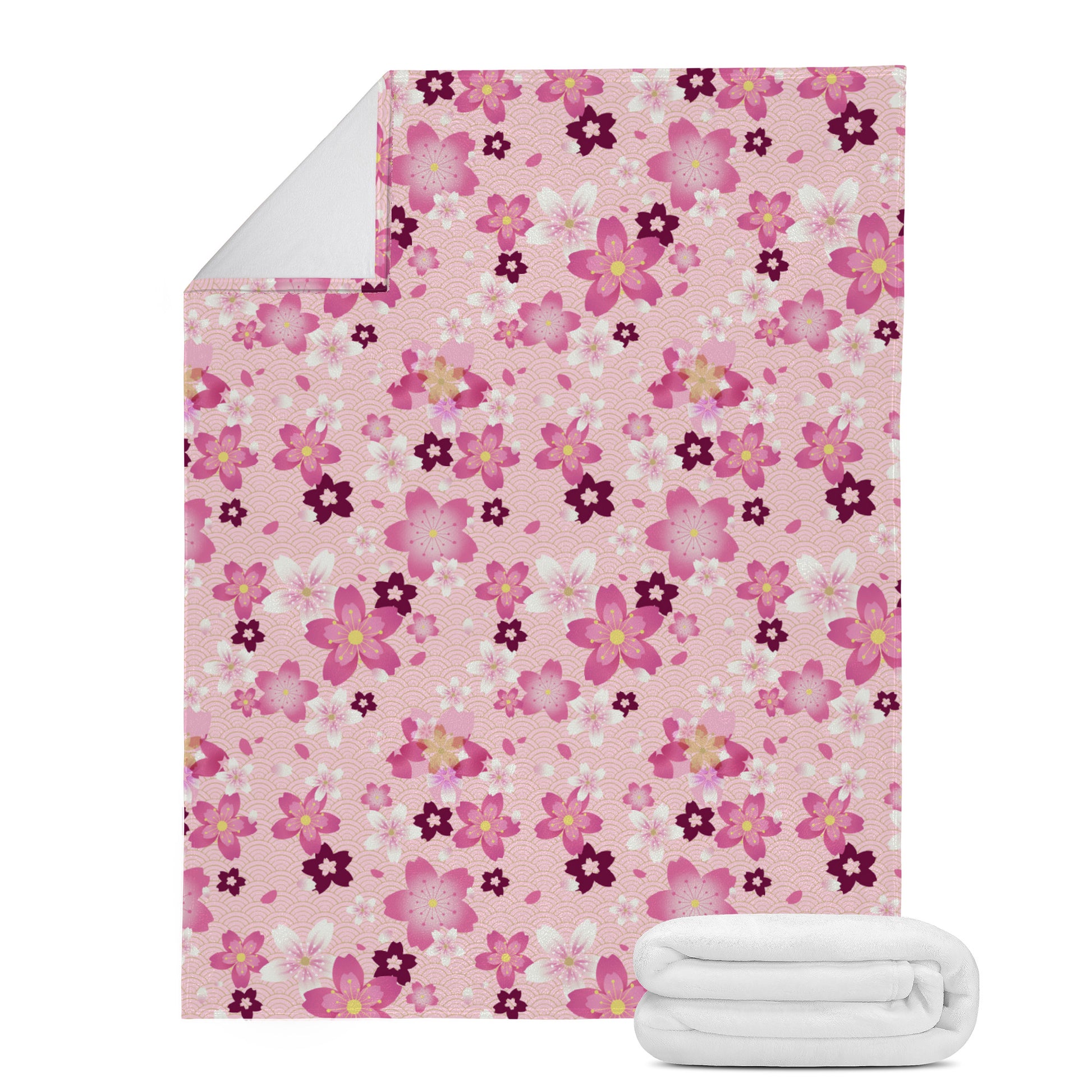 Cozy up with the Sakura Blanket (Pink), featuring soft suede and micro fleece for ultimate warmth and style.