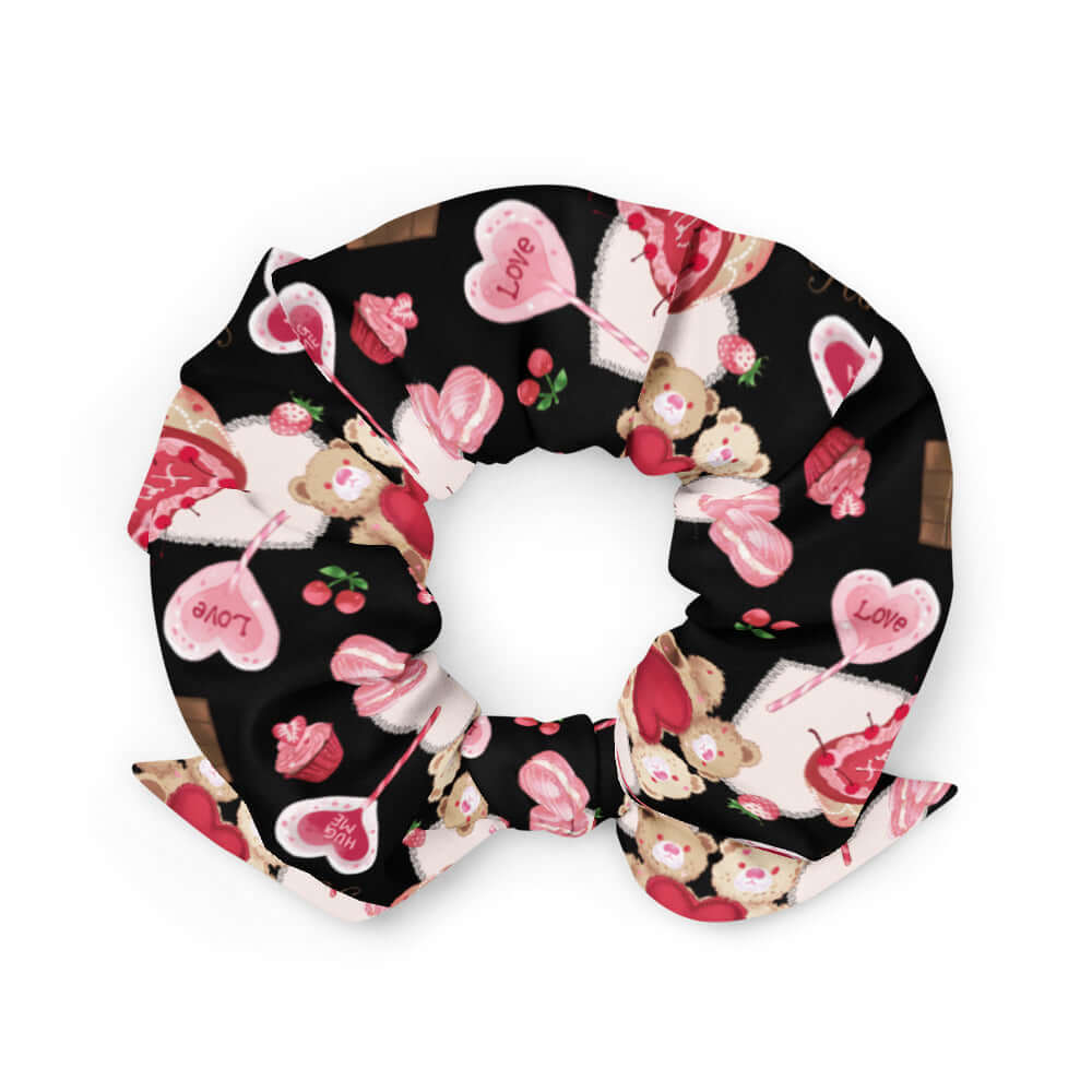 Cute and stylish, the Sugar Sweetheart Scrunchie features a fun Valentine’s Day design perfect for any outfit!