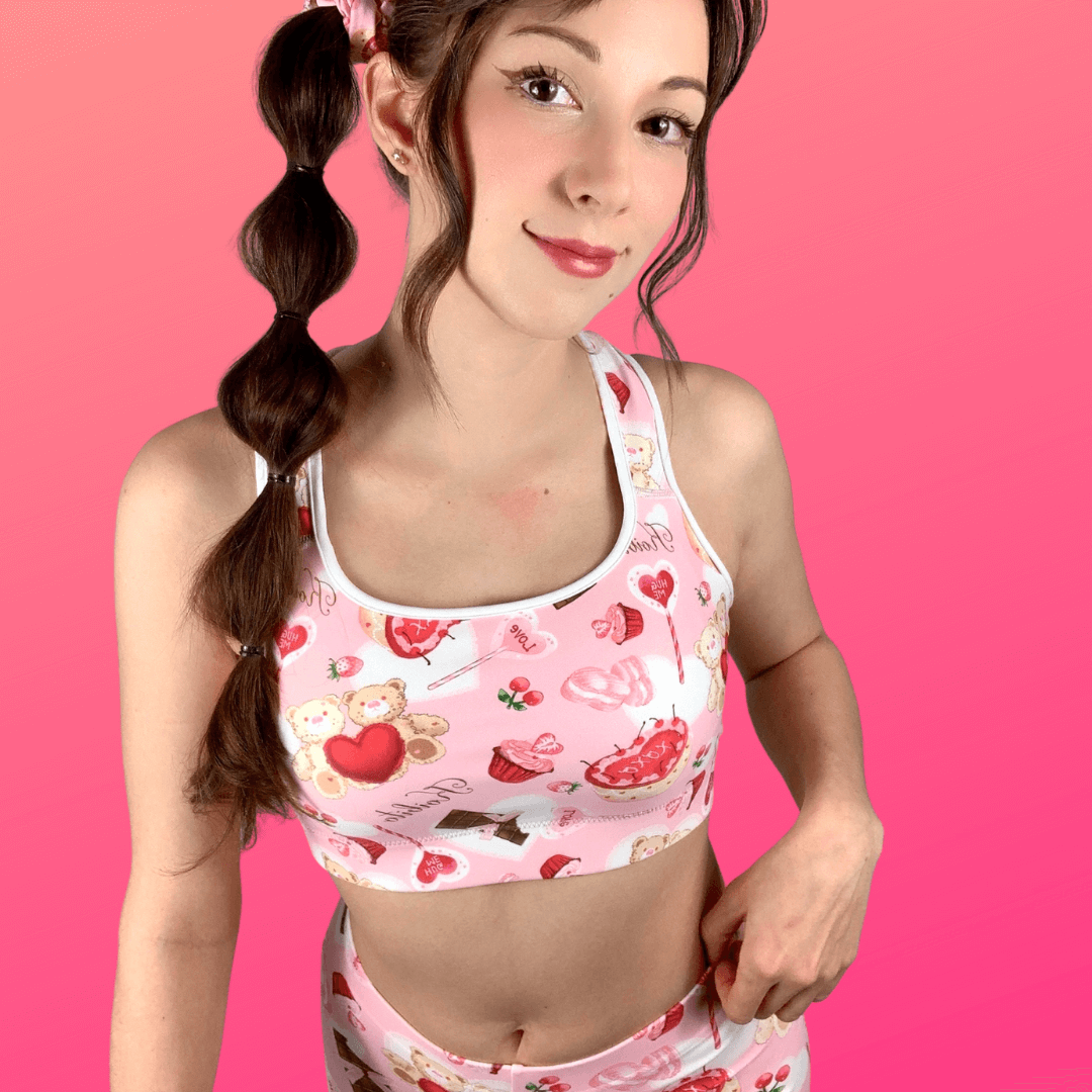 Cute model showcases the Sugar Sweetheart Sports bra from Koibito Clothing, perfect for stylish workouts.