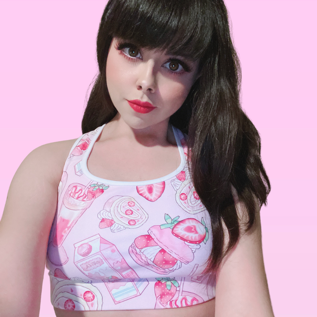 Sweet and stylish, the Strawberry Sports Bra offers support and comfort for any occasion. Perfect for active moments!