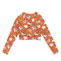 Bright orange Trick or Treaters Long-sleeved Crop Top featuring playful dog designs, perfect for eco-friendly athleisure.